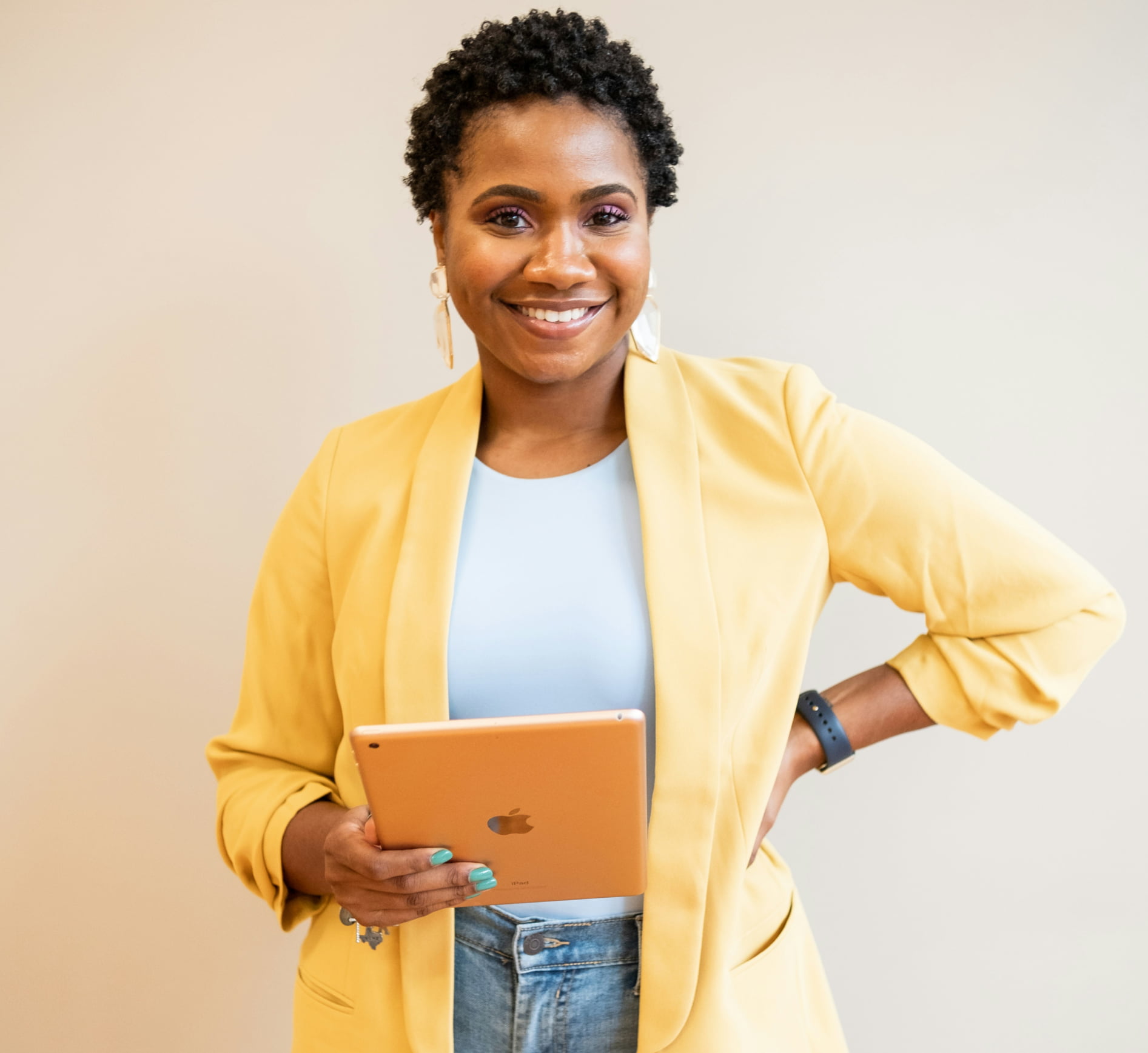 A woman holding an iPad